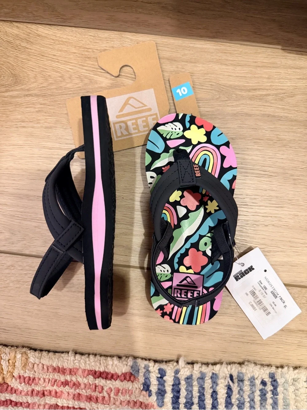 Reef Kids Black Flip Flops with Pink and Multicolor Floral Rainbow Print